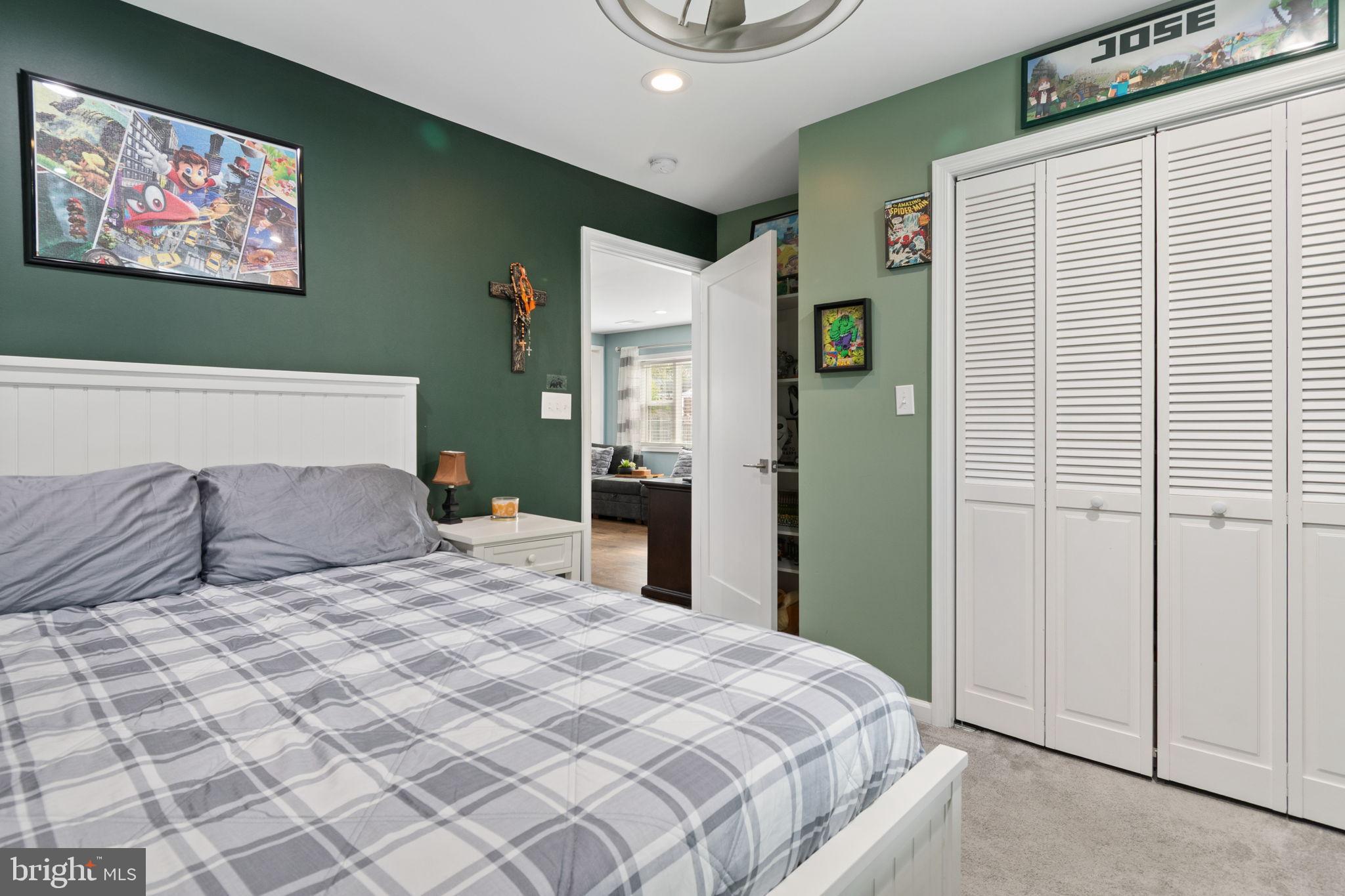 608 Blue Ridge Avenue Northeast Leesburg, VA 20176 - Photo 18 of 36 a bedroom with a large bed and a window