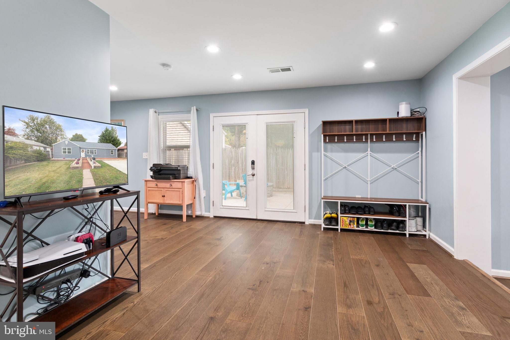 608 Blue Ridge Avenue Northeast Leesburg, VA 20176 - Photo 19 of 36 a view of workspace with furniture and wooden floor