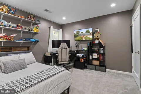 a bedroom with a bed and cabinets