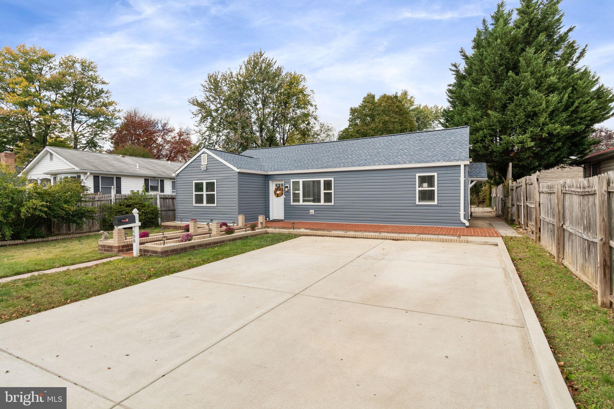 608 Blue Ridge Avenue Northeast Leesburg, VA 20176 - Photo 4 of 36 a front view of a house with a yard