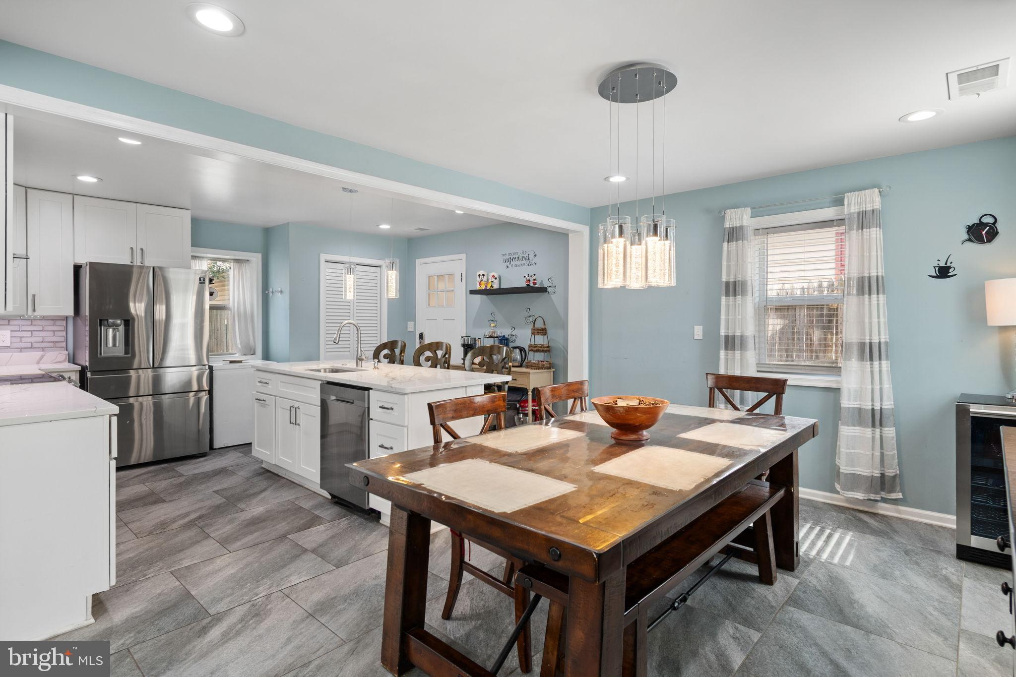 608 Blue Ridge Avenue Northeast Leesburg, VA 20176 - Photo 9 of 36 a view of a dining room with furniture and wooden floor