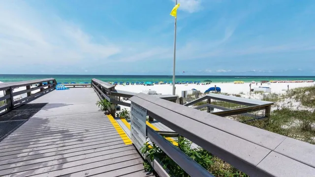 a wooden deck with a table and chairs