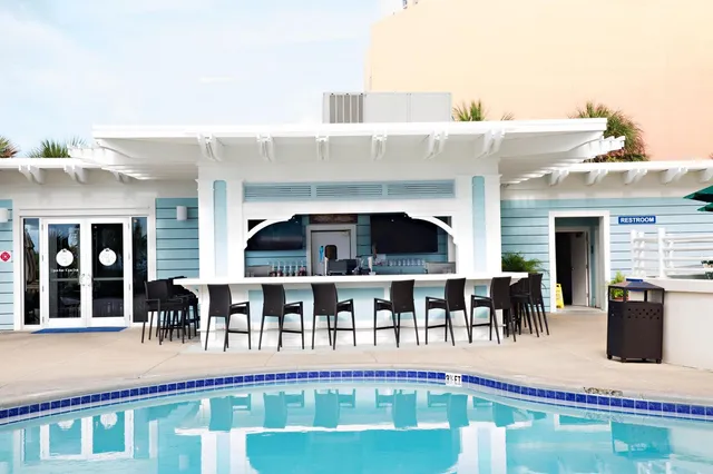 a view of swimming pool with outdoor seating