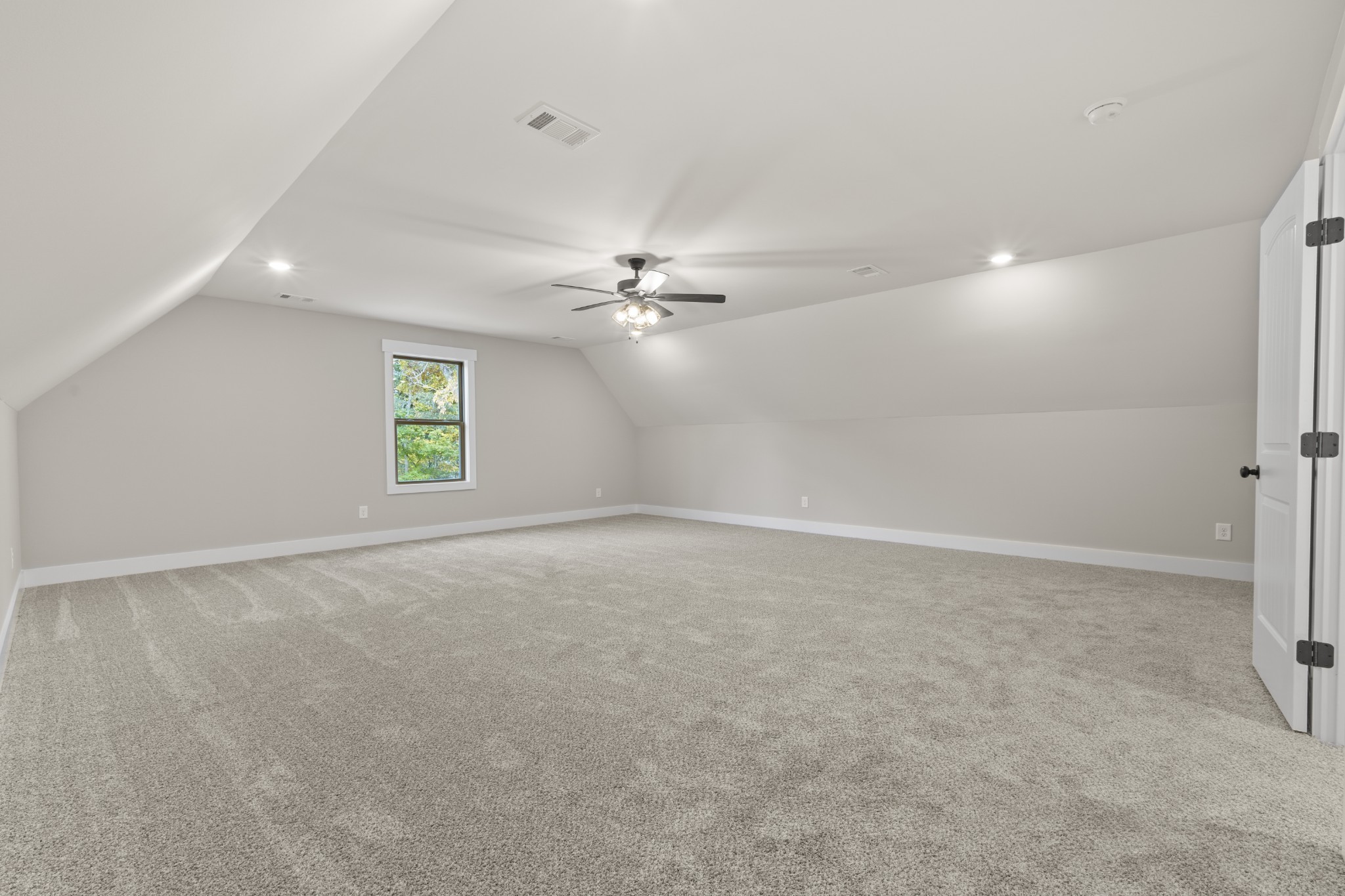 2969 Lights Chapel Road Greenbrier, TN 37073 - Photo 27 of 34 an empty room with windows and fan