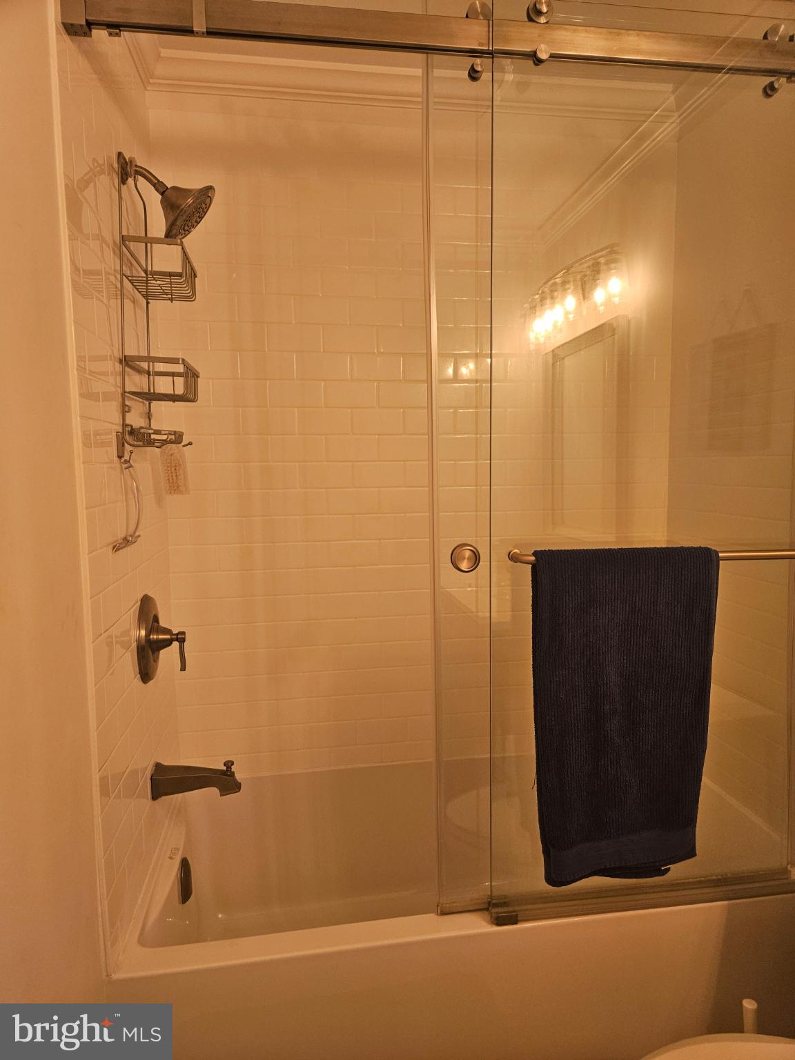 200 Market Square, Unit 14A Cambridge, MD 21613 - Photo 36 of 59 Sleek modern bathroom with glass shower.