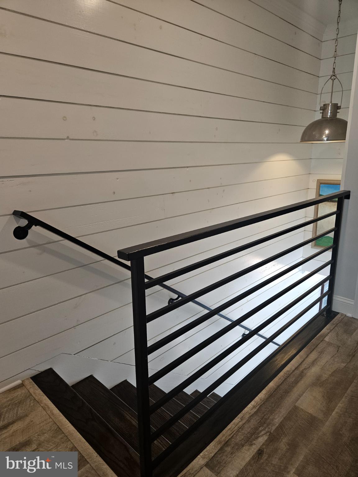 200 Market Square, Unit 14A Cambridge, MD 21613 - Photo 37 of 59 Modern staircase with sleek railing design.