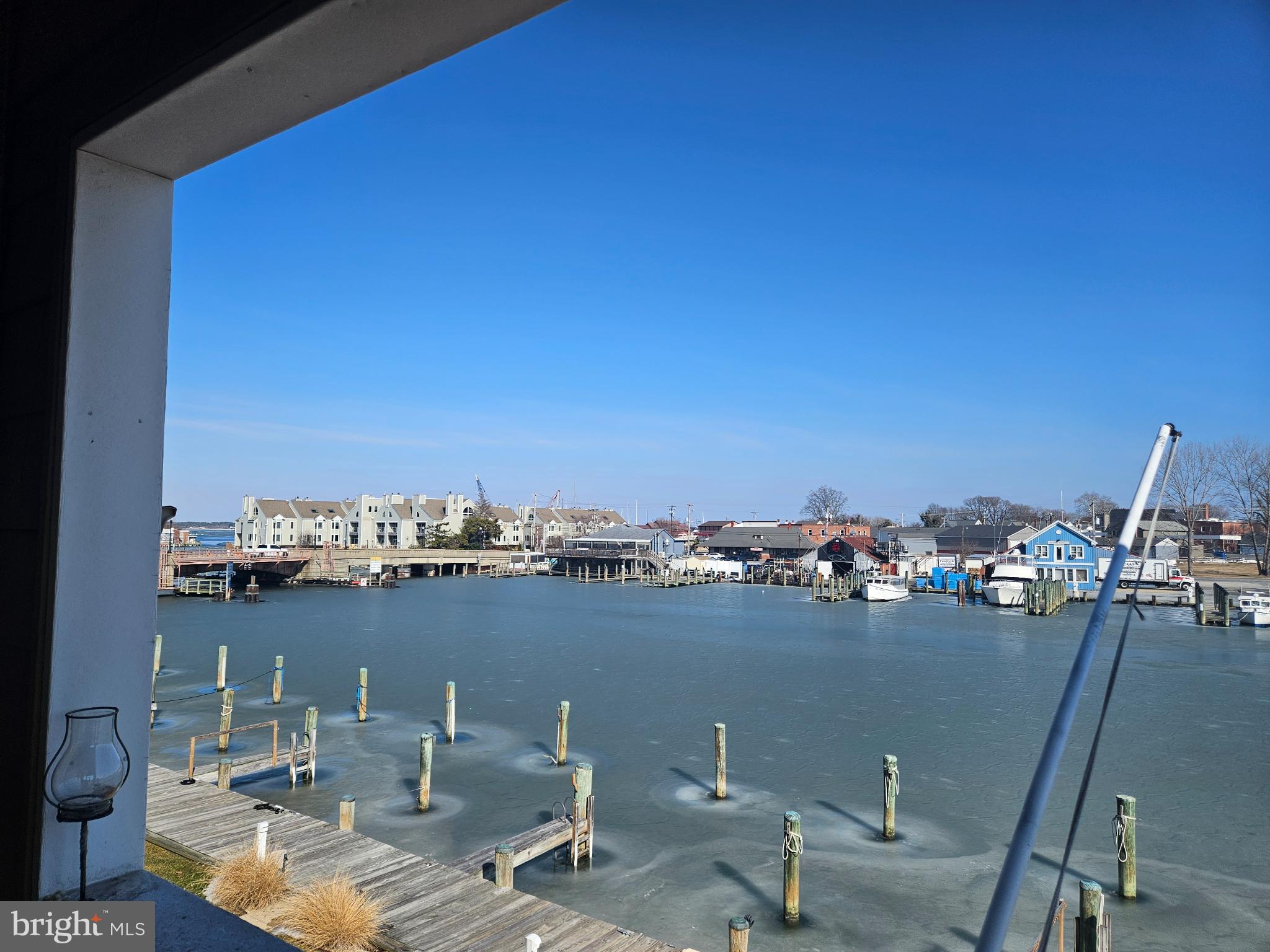 200 Market Square, Unit 14A Cambridge, MD 21613 - Photo 41 of 59 Scenic waterfront view under a clear sky.