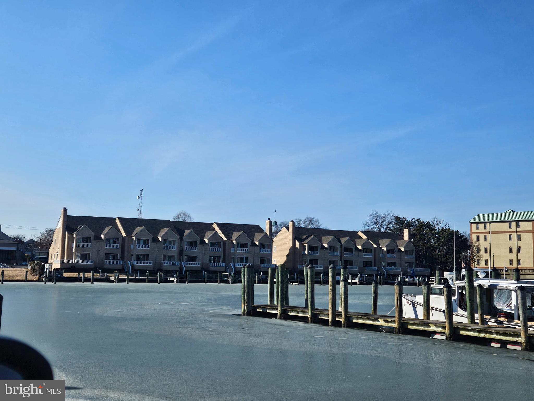 200 Market Square, Unit 14A Cambridge, MD 21613 - Photo 57 of 59 View of the back of condos from across the creek