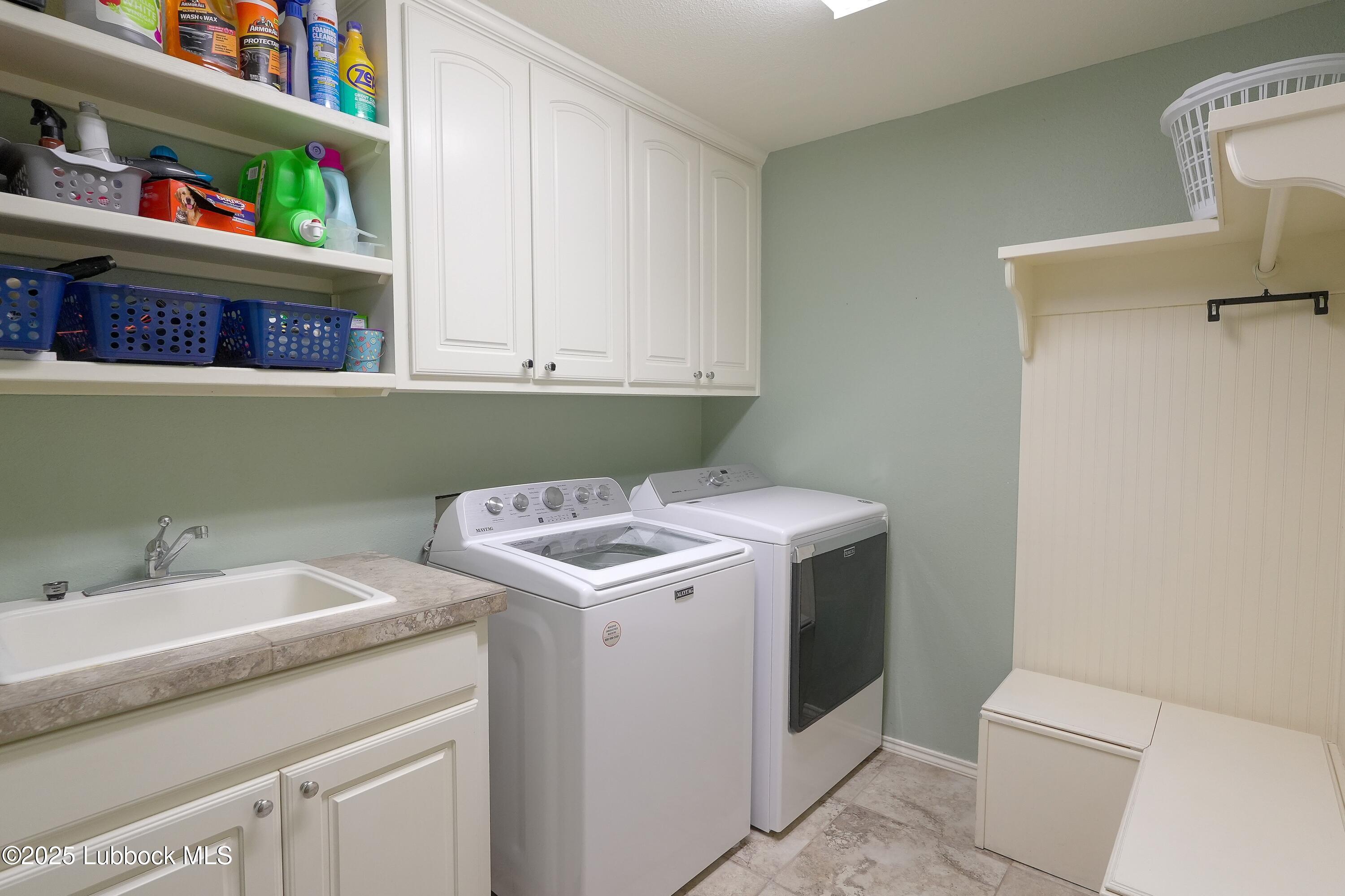 5904 110th Street Lubbock, TX 79424 - Photo 27 of 32 a utility room with dryer and washer