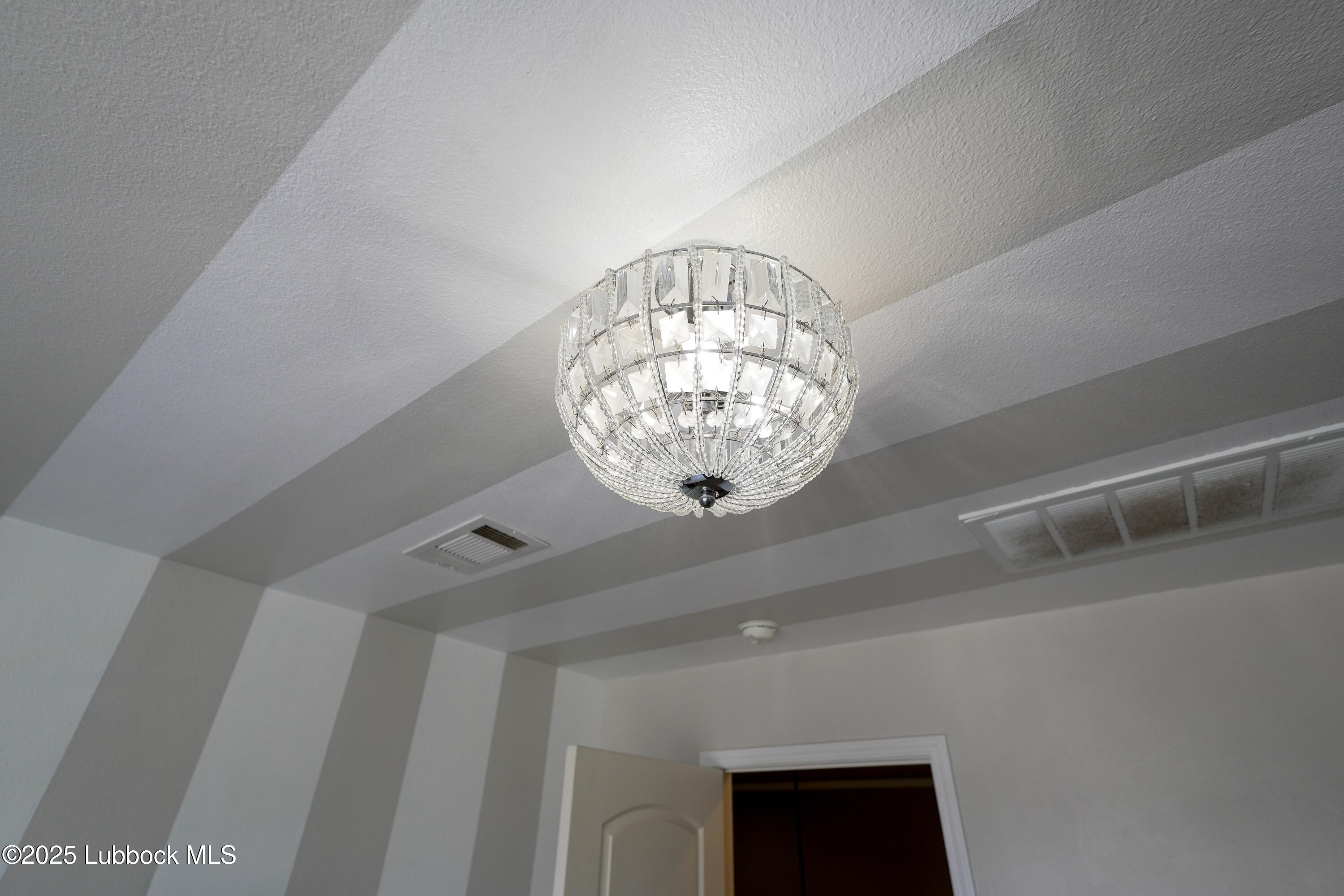 5904 110th Street Lubbock, TX 79424 - Photo 28 of 32 a view of chandelier and entryway