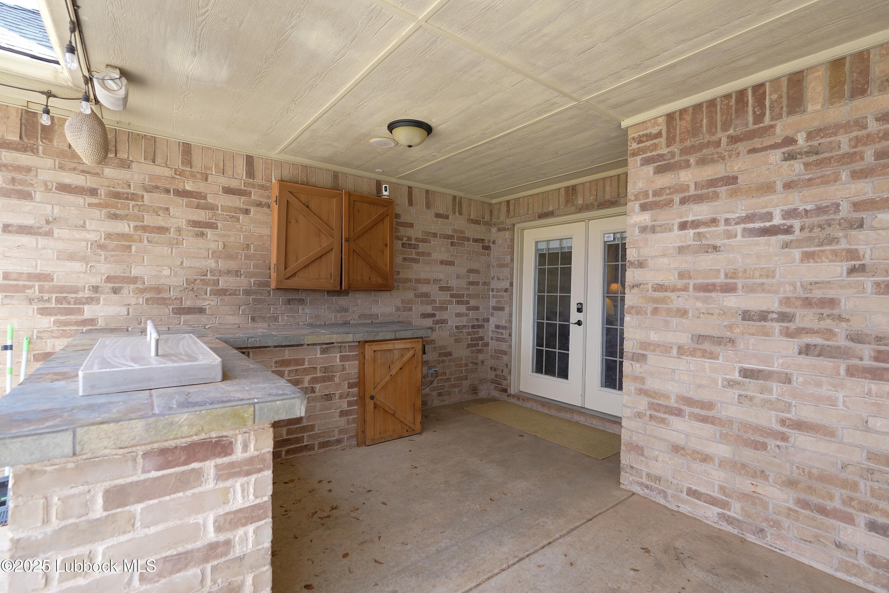 5904 110th Street Lubbock, TX 79424 - Photo 30 of 32 a view of a brick house with an empty space