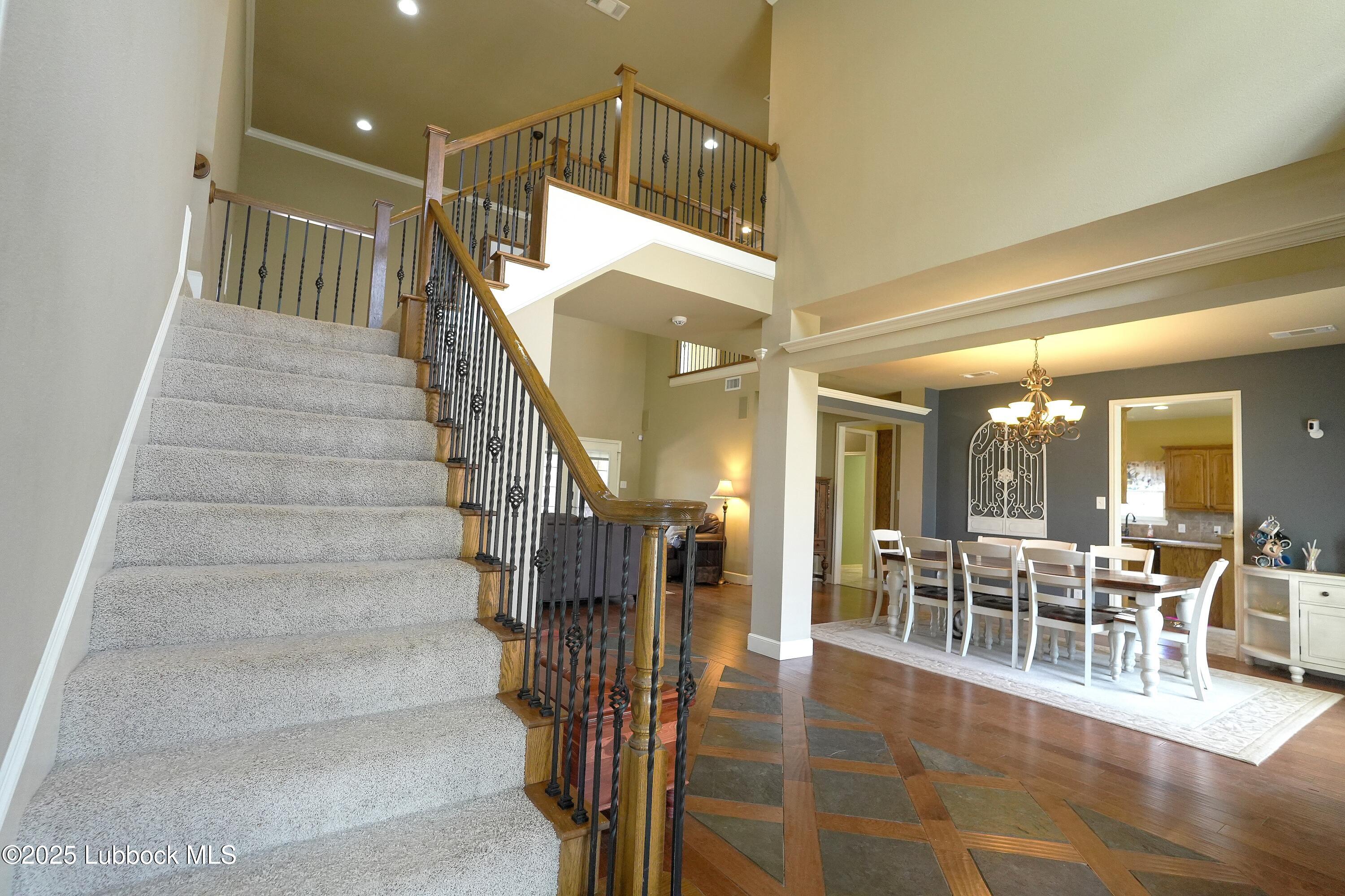 5904 110th Street Lubbock, TX 79424 - Photo 3 of 32 a view of a dining room with furniture and wooden floor