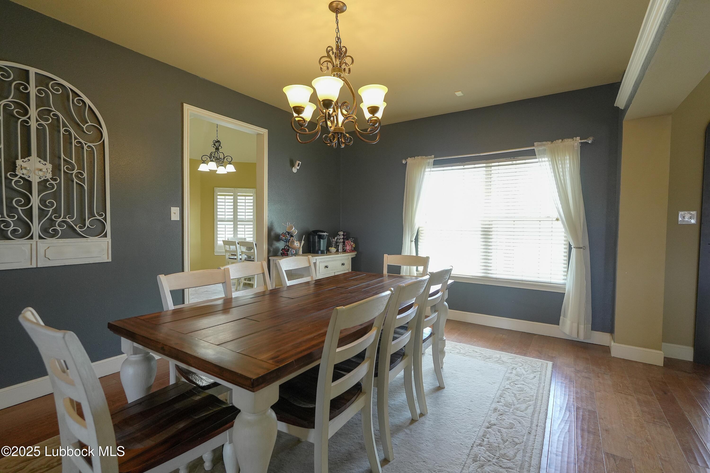 5904 110th Street Lubbock, TX 79424 - Photo 5 of 32 a view of a dining room with furniture and window