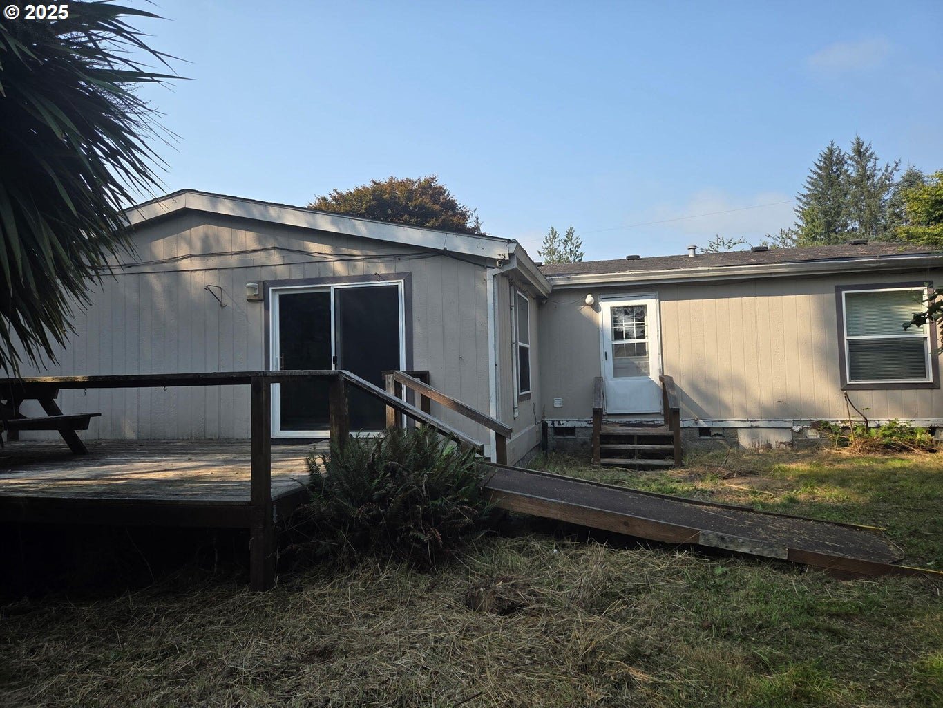 9225 Millcreek Road Tillamook, OR 97141 - Photo 13 of 19 a view of a house with backyard and garden