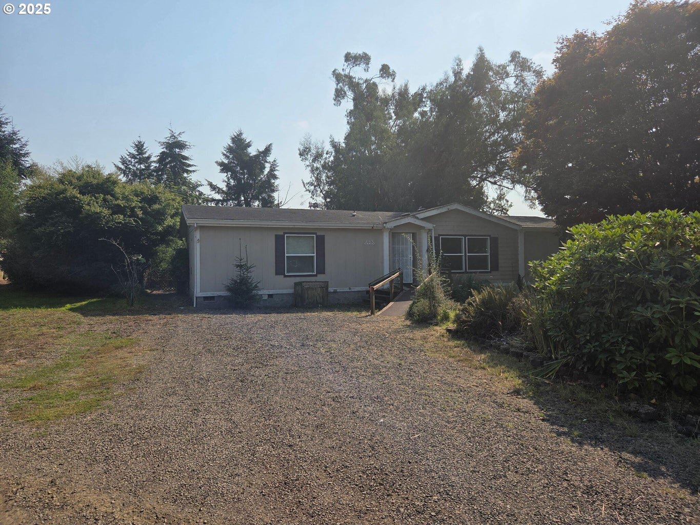 9225 Millcreek Road Tillamook, OR 97141 - Photo 14 of 19 front view of a house with a yard and trees