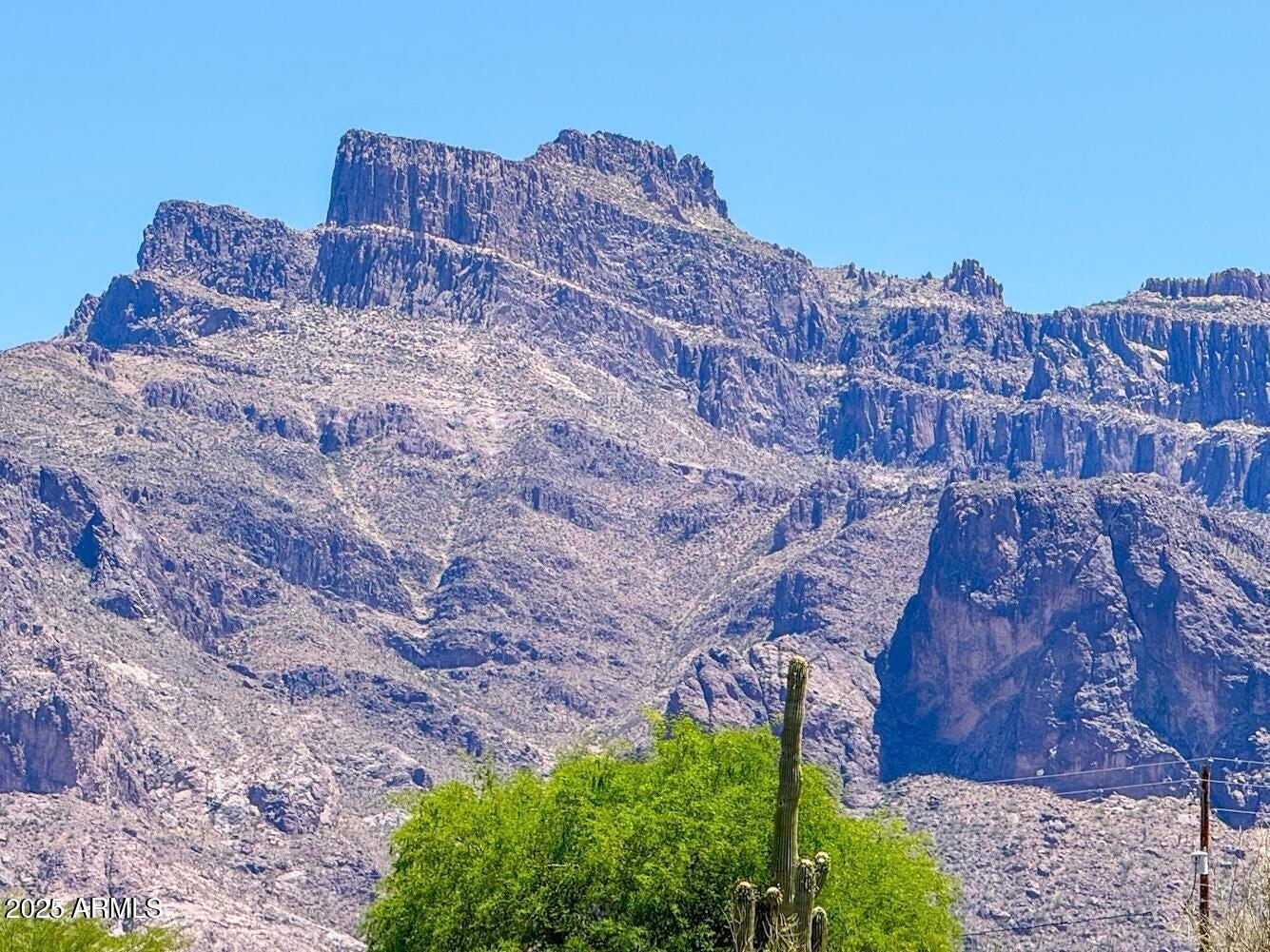 0 North Roadrunner Road Apache Junction, AZ 85119 - Photo 7 of 12 a large brick building with a mountain in the background