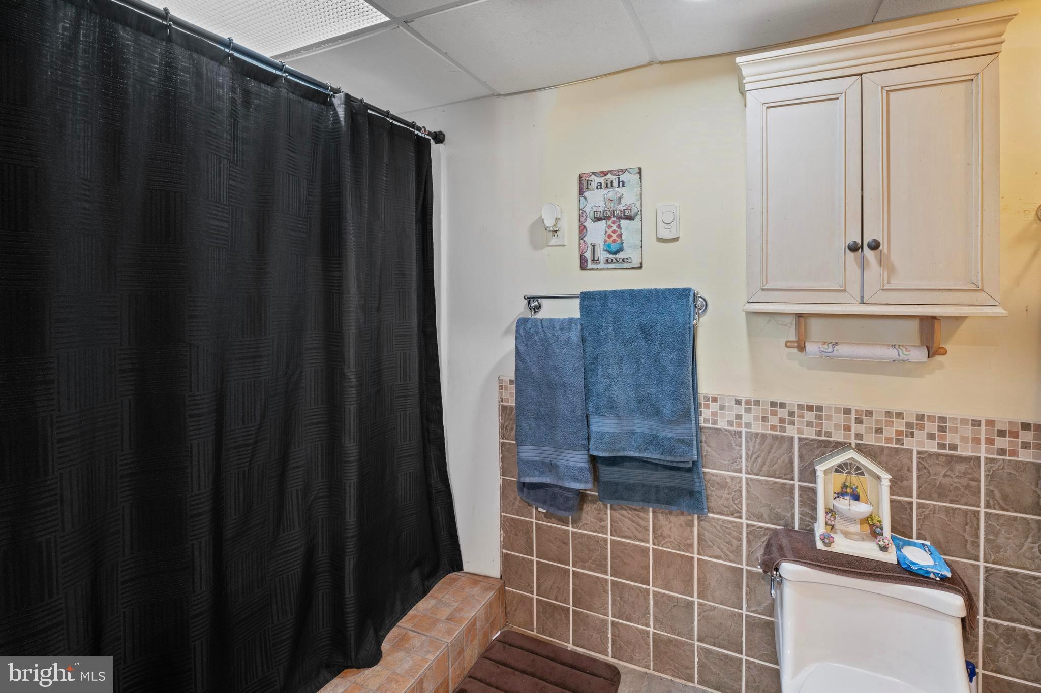 870 Downe Avenue Fortescue, NJ 08321 - Photo 15 of 26 a bathroom with a sink and a shower