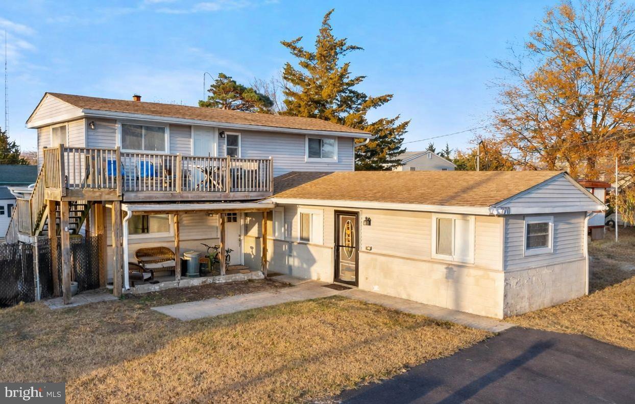 870 Downe Avenue Fortescue, NJ 08321 - Photo 2 of 26 a front view of a house with a yard