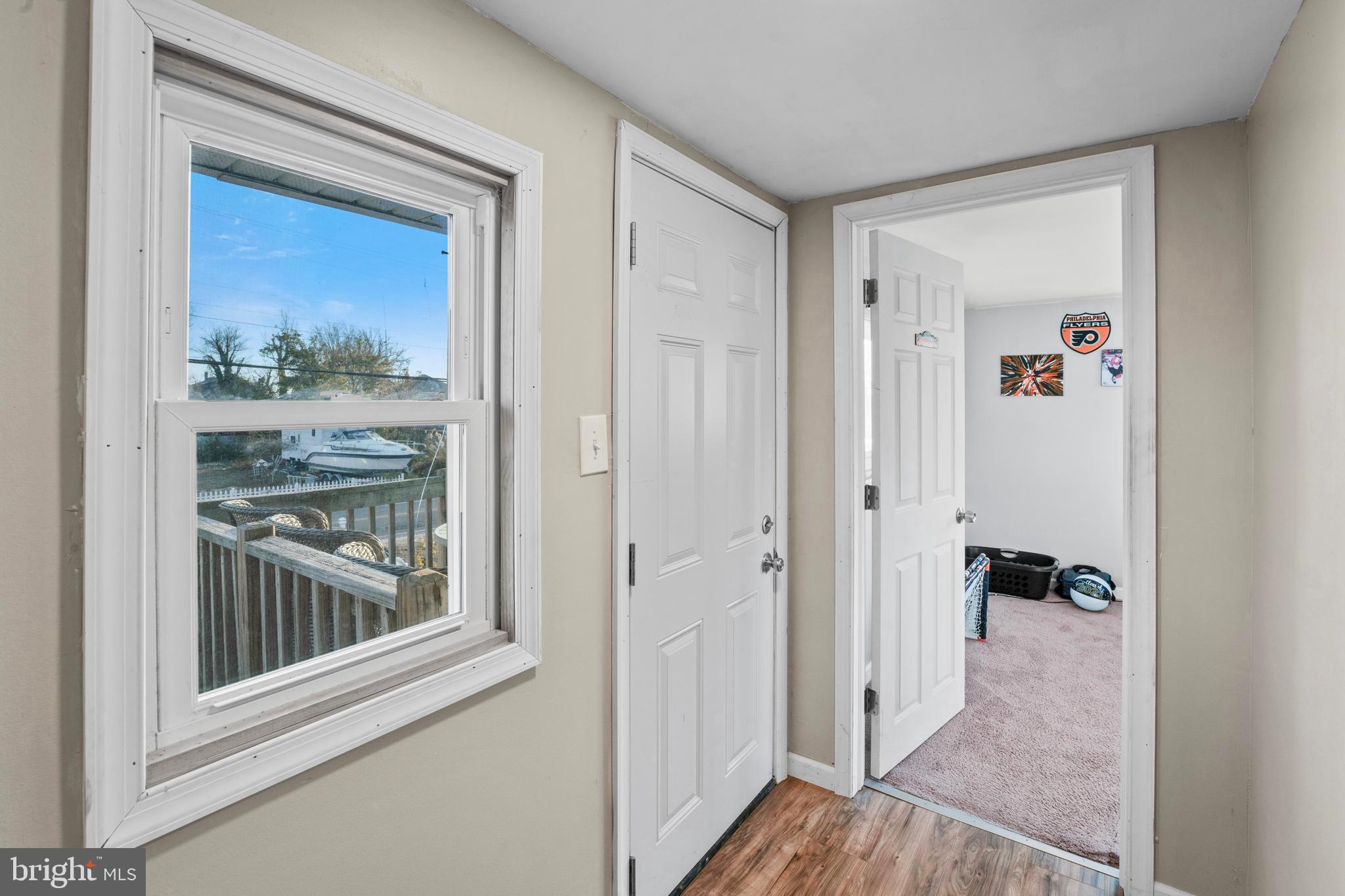 870 Downe Avenue Fortescue, NJ 08321 - Photo 21 of 26 a view of a hallway view with wooden floor and a bathroom