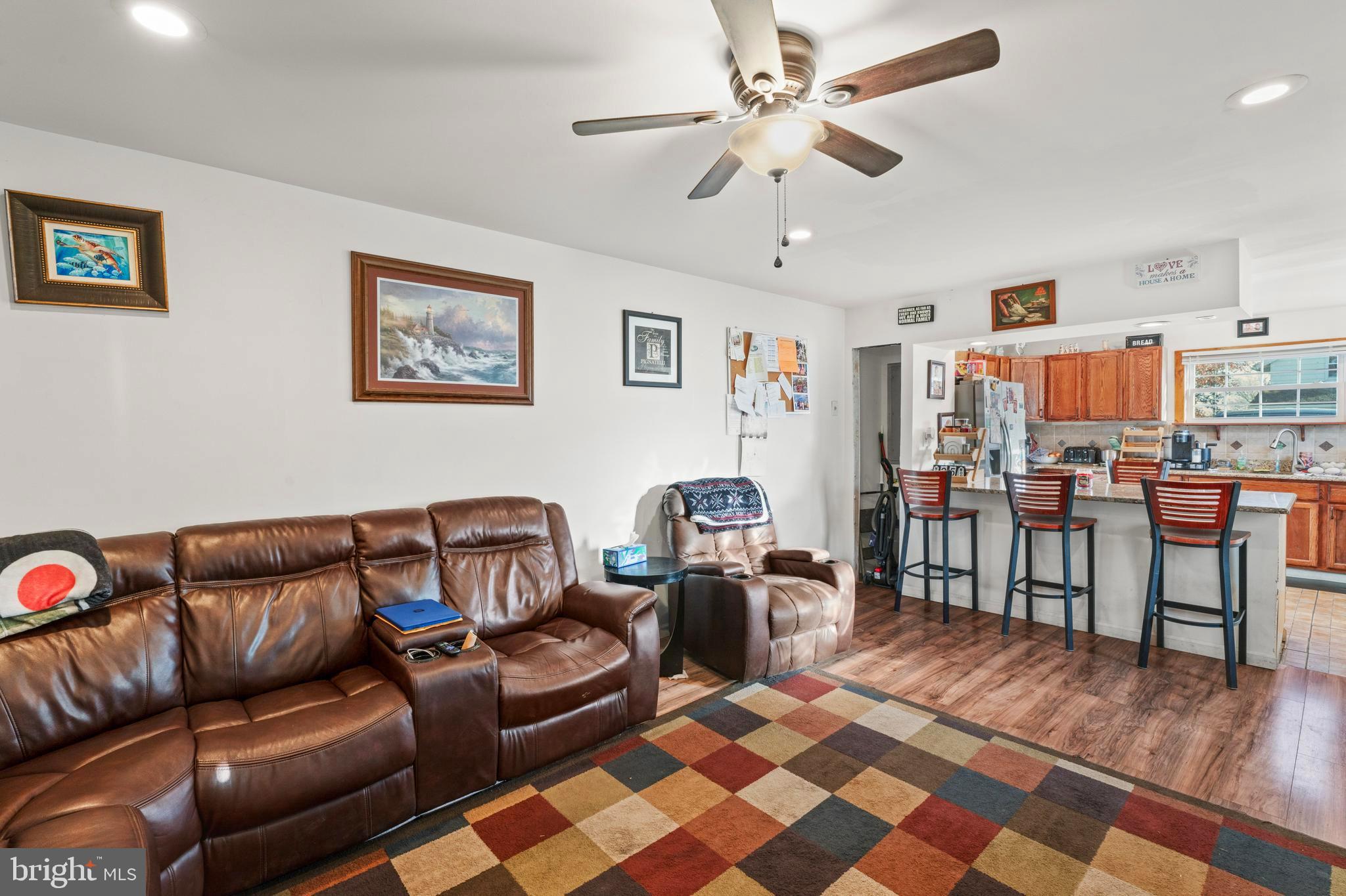 870 Downe Avenue Fortescue, NJ 08321 - Photo 10 of 26 a living room with furniture and a dining table with bookshelf
