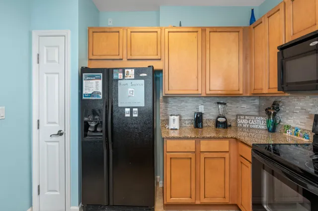 a bathroom with a granite countertop sink toilet a large mirror a shower and a bathtub