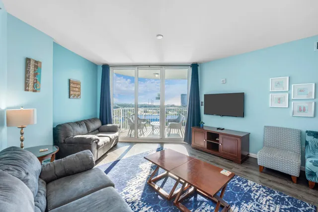 a view of swimming pool with outdoor seating and a patio