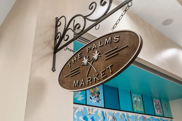 an aerial view of a residential building with swimming pool and lake view