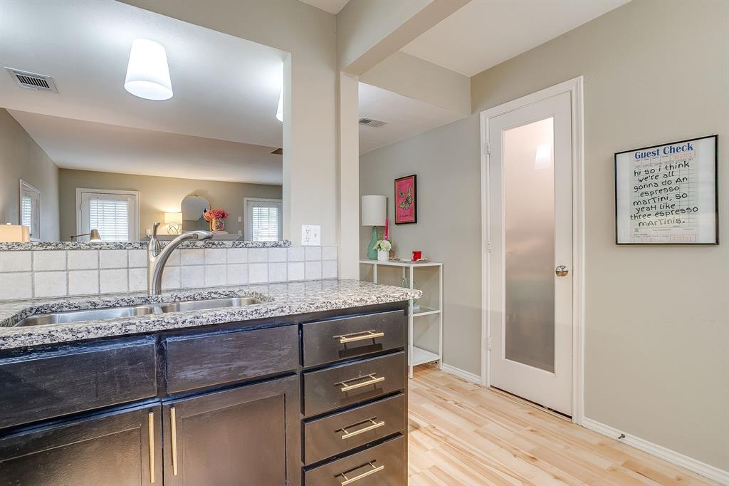 1211 Roaring Springs Road Fort Worth, TX 76114 - Photo 7 of 33 a bathroom with a granite countertop sink and a mirror