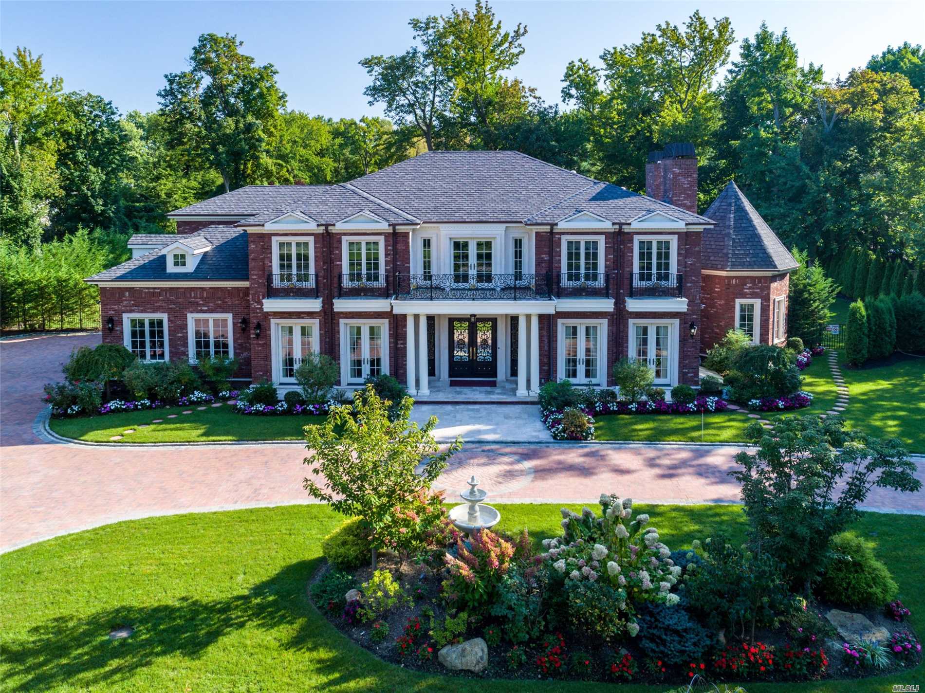 4 Henhawk Road Great Neck, NY 11024 - Photo 1 of 1 a front view of a house with garden