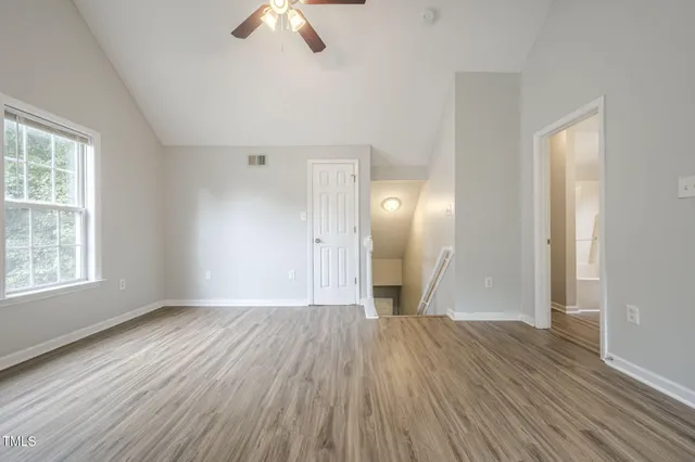 a kitchen with kitchen island granite countertop a sink and a stove