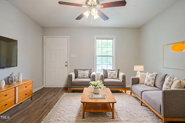 a picture of a bench in front of a wall