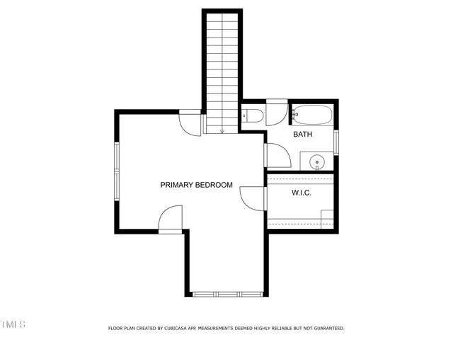 a picture of a bench in front of a wall