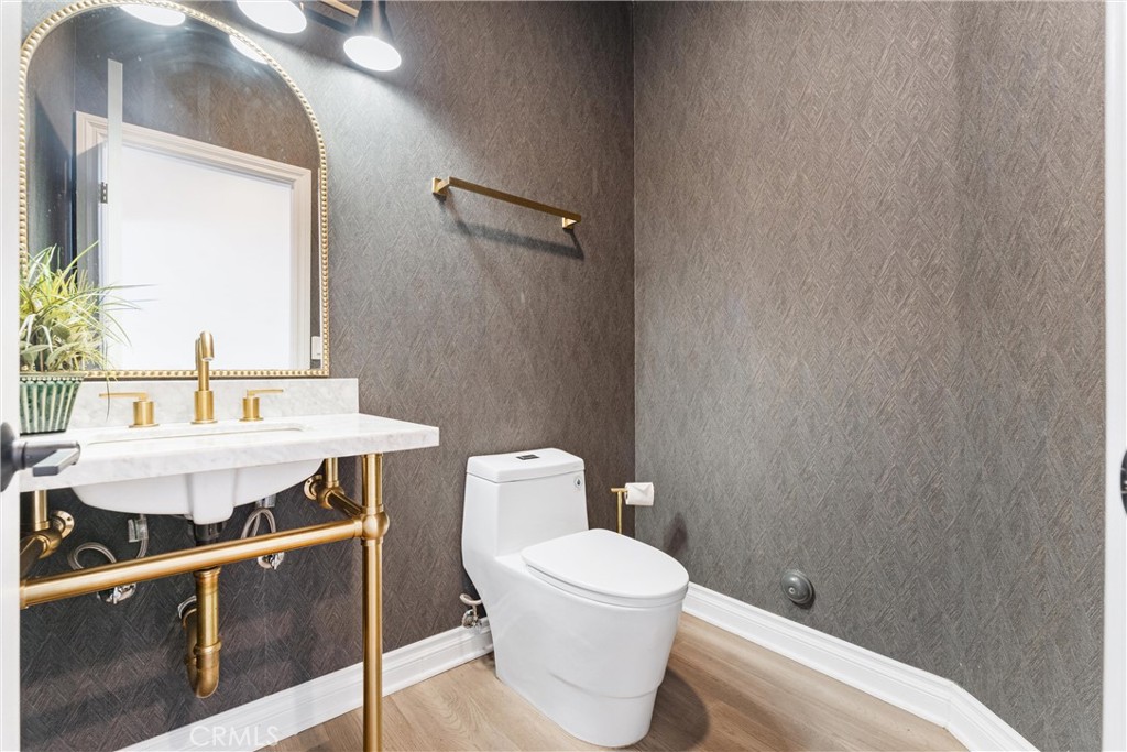 927 Avocado Crest Road La Habra Heights, CA 90631 - Photo 20 of 72 a bathroom with a toilet a sink and mirror