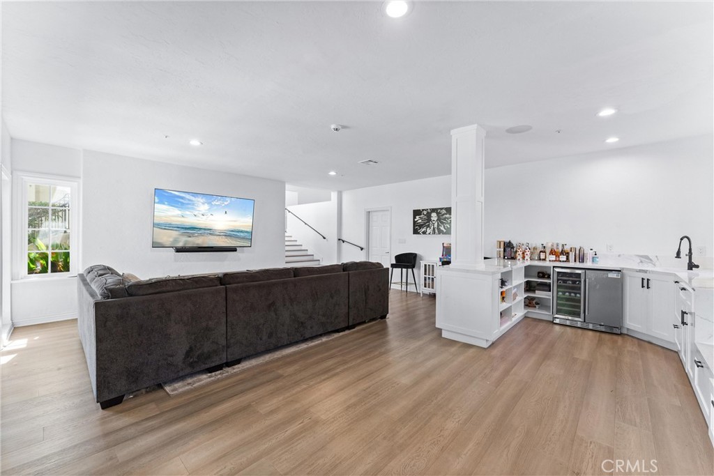 927 Avocado Crest Road La Habra Heights, CA 90631 - Photo 22 of 72 a living room with furniture and a flat screen tv