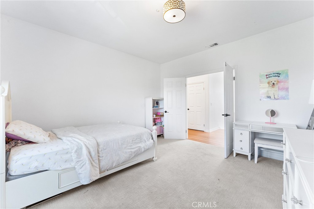 927 Avocado Crest Road La Habra Heights, CA 90631 - Photo 27 of 72 a bedroom with a bed and a desk