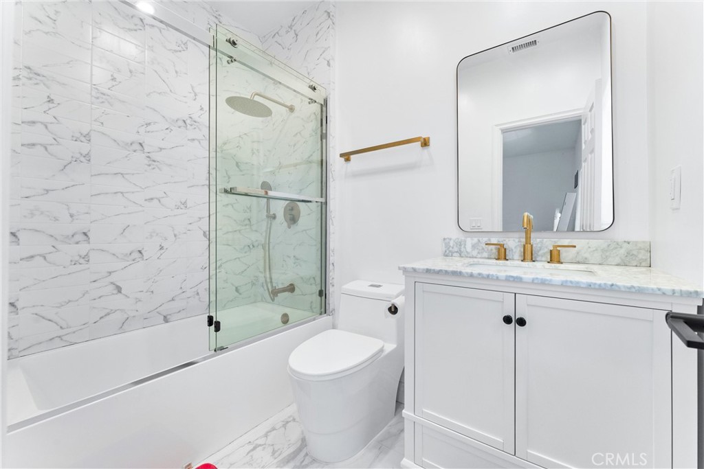 927 Avocado Crest Road La Habra Heights, CA 90631 - Photo 28 of 72 a bathroom with a sink a toilet and shower
