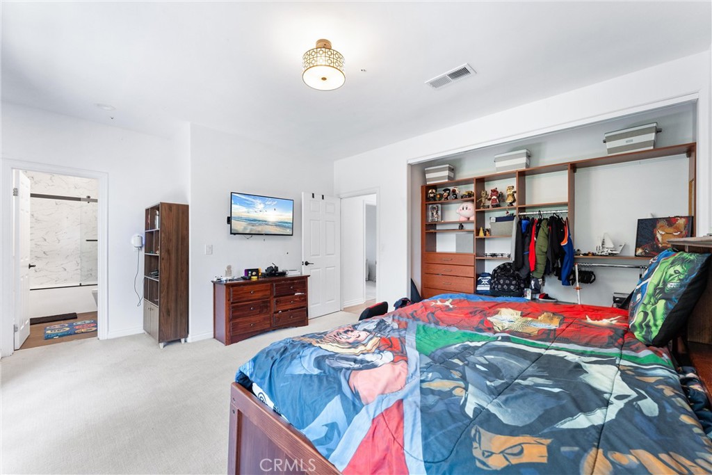 927 Avocado Crest Road La Habra Heights, CA 90631 - Photo 30 of 72 a bed room with a bed and a tv