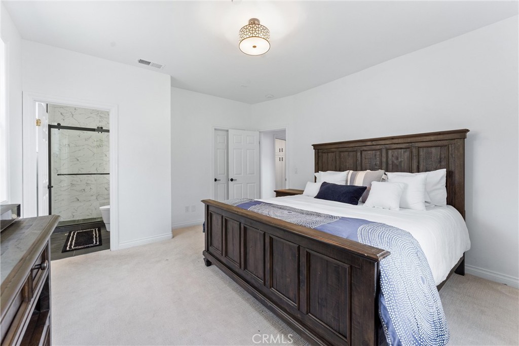 927 Avocado Crest Road La Habra Heights, CA 90631 - Photo 32 of 72 a bedroom with a bed and a window