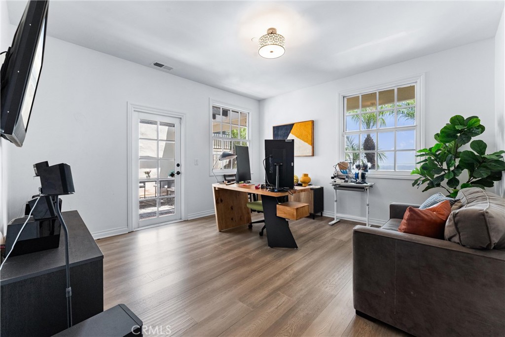 927 Avocado Crest Road La Habra Heights, CA 90631 - Photo 38 of 72 a living room with furniture a window and a flat screen tv
