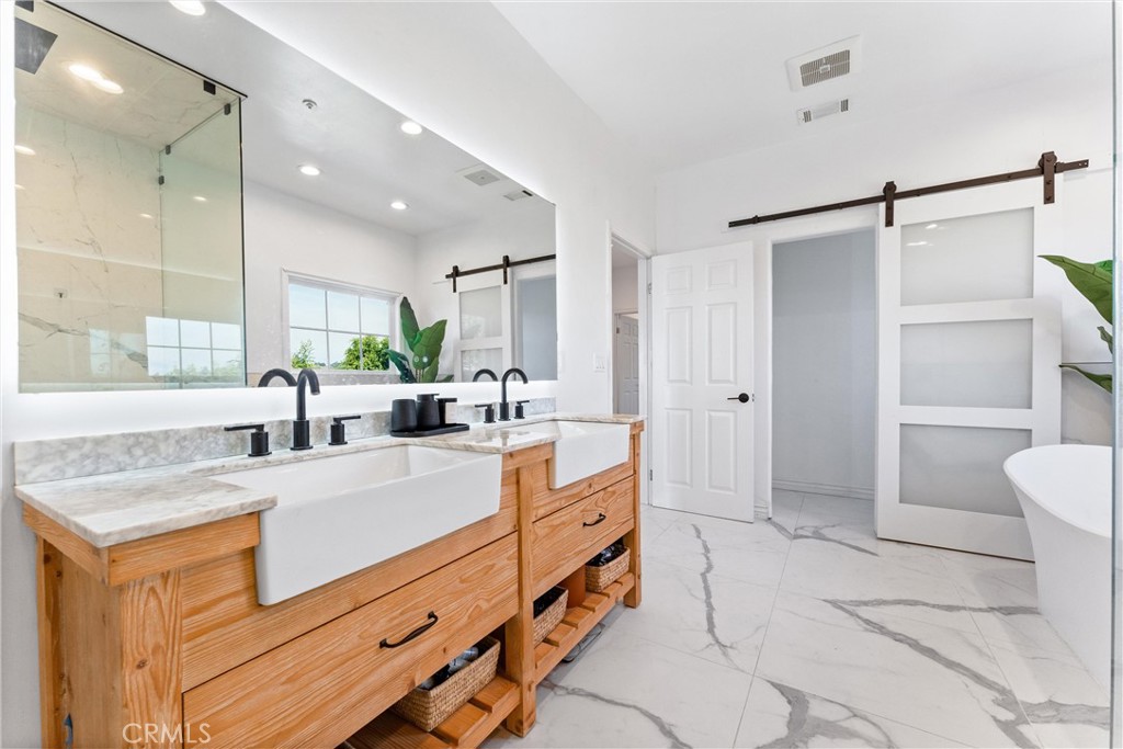 927 Avocado Crest Road La Habra Heights, CA 90631 - Photo 44 of 72 a large white bathroom with a granite countertop sink mirror and bathtub