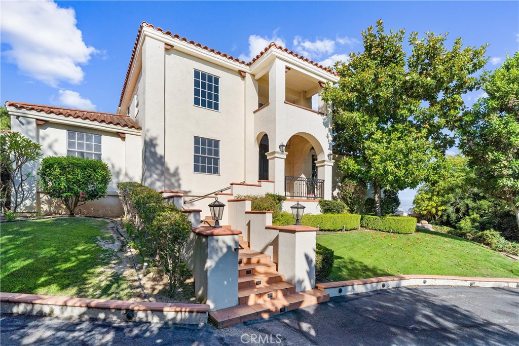 927 Avocado Crest Road La Habra Heights, CA 90631 - Photo 5 of 72 a front view of a house with a yard
