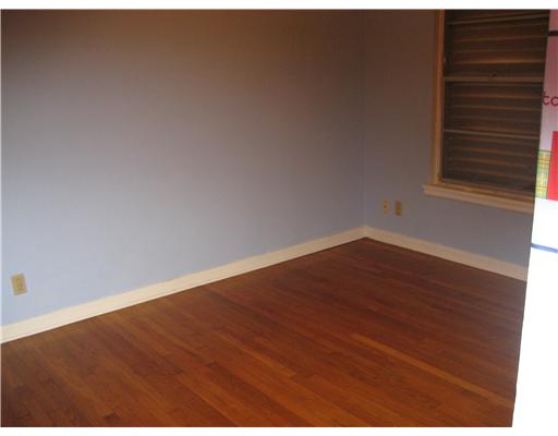 4526 Dolphin Place Corpus Christi, TX 78411 - Photo 8 of 10 a view of an empty room with wooden floor
