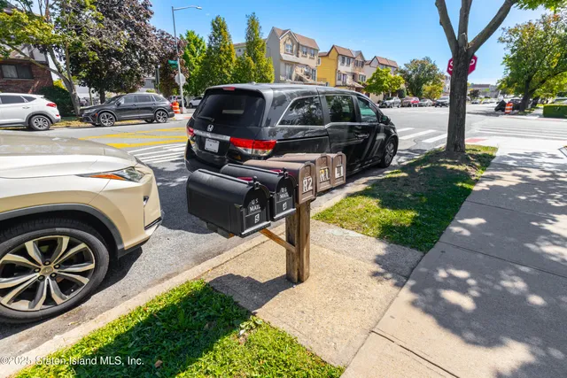 an outdoor view of a house with swimming pool and furniture