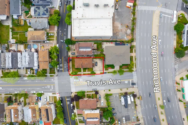 a view of street with parked cars