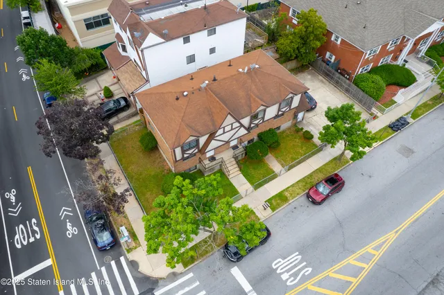 an aerial view of a house with a garden