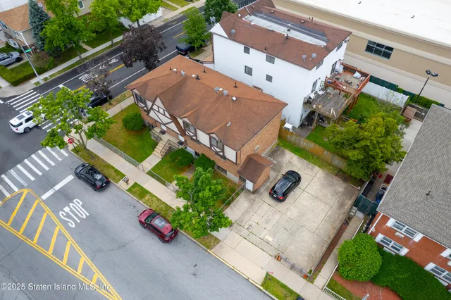 an aerial view of a house with a garden