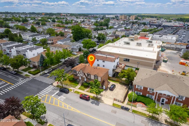 an aerial view of a house with a garden