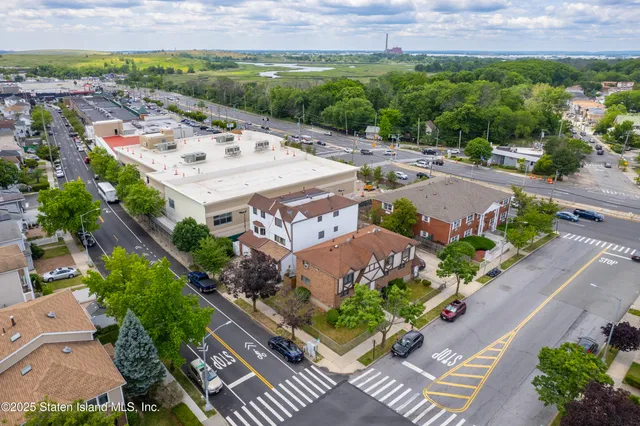 an aerial view of a house with a garden