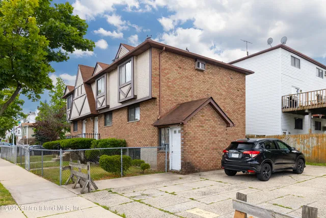 a car parked in front of a house