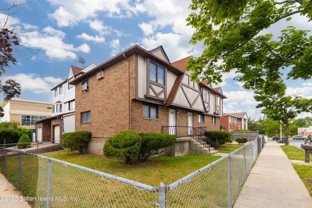 a view of a parked cars in front of a house